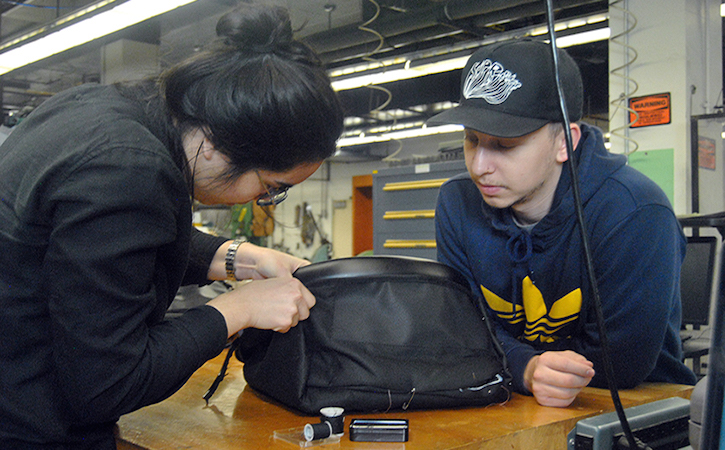 Two students work on a design prototype