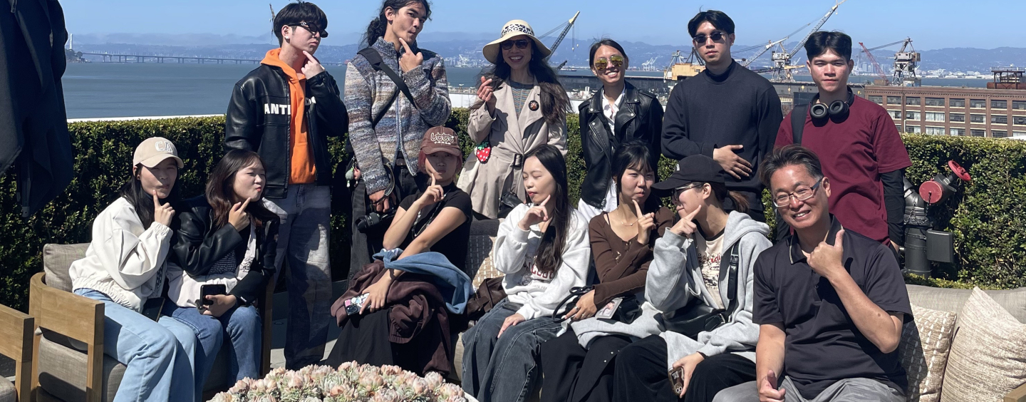 Eleven students from MCTU, with Professor Zun-Hwa Chiang, on a San Francisco rooftop lounge overlooking the Bay